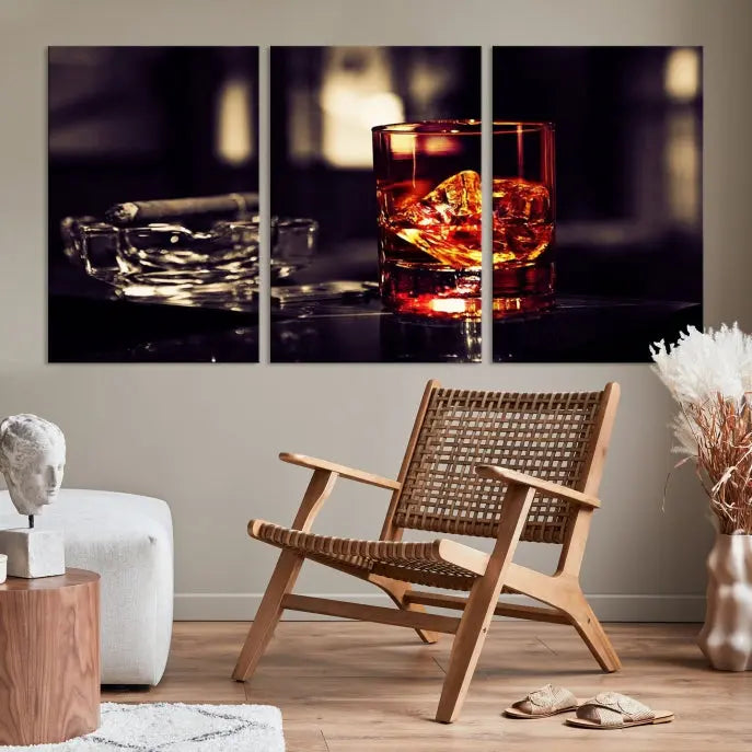 The Whiskey and Cigar Canvas, a luxurious triptych wall art for your living room or bar, portrays a whiskey glass and cigar on a table. This artwork beautifully captures the essence of opulent home decor.