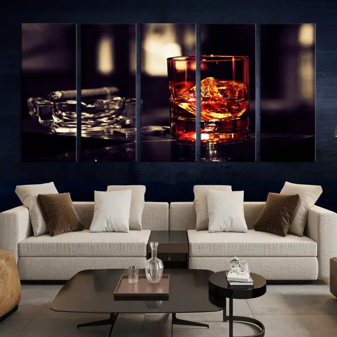 The Whiskey and Cigar Canvas, a luxurious triptych wall art for your living room or bar, portrays a whiskey glass and cigar on a table. This artwork beautifully captures the essence of opulent home decor.