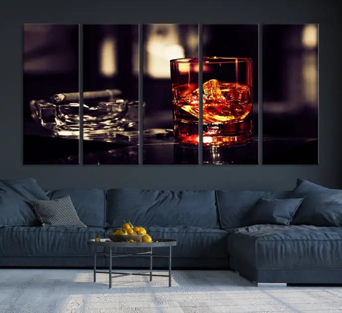 The Whiskey and Cigar Canvas, a luxurious triptych wall art for your living room or bar, portrays a whiskey glass and cigar on a table. This artwork beautifully captures the essence of opulent home decor.