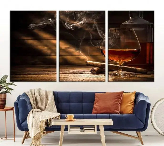 Whiskey and Cigar Wall Art Canvas Print showcases a glass of brandy, a lit cigar, and swirling smoke. This museum-quality canvas is ready to hang and features a UV-protective coating for enduring vibrancy.