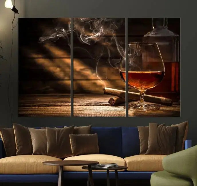 Whiskey and Cigar Wall Art Canvas Print showcases a glass of brandy, a lit cigar, and swirling smoke. This museum-quality canvas is ready to hang and features a UV-protective coating for enduring vibrancy.