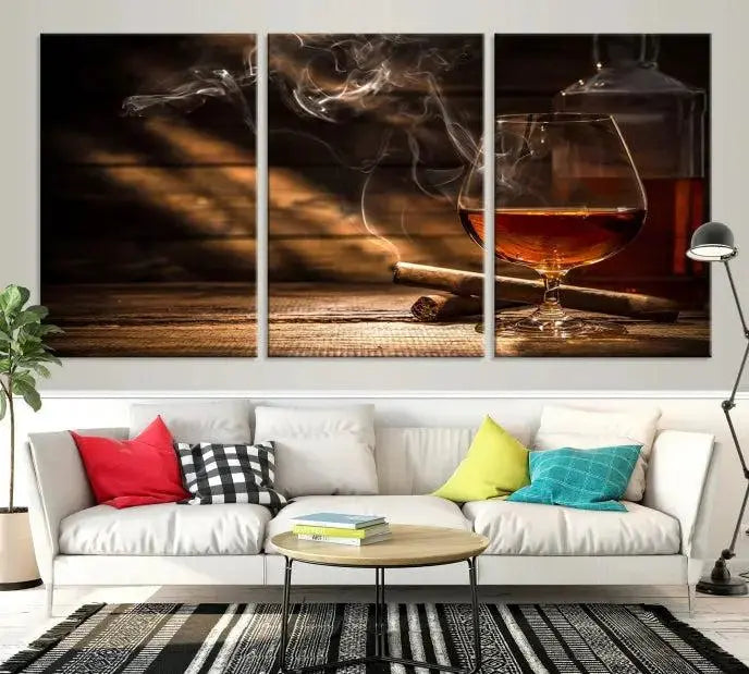 Whiskey and Cigar Wall Art Canvas Print showcases a glass of brandy, a lit cigar, and swirling smoke. This museum-quality canvas is ready to hang and features a UV-protective coating for enduring vibrancy.