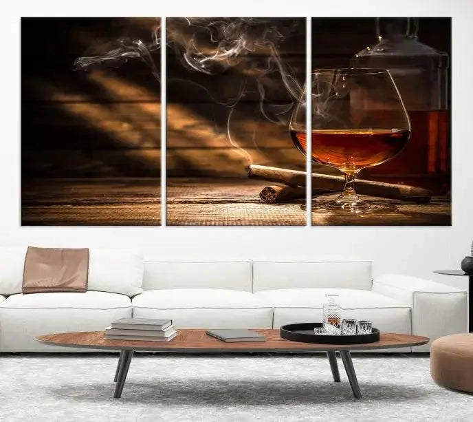 Whiskey and Cigar Wall Art Canvas Print showcases a glass of brandy, a lit cigar, and swirling smoke. This museum-quality canvas is ready to hang and features a UV-protective coating for enduring vibrancy.