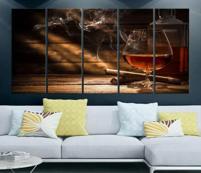 Whiskey and Cigar Wall Art Canvas Print showcases a glass of brandy, a lit cigar, and swirling smoke. This museum-quality canvas is ready to hang and features a UV-protective coating for enduring vibrancy.