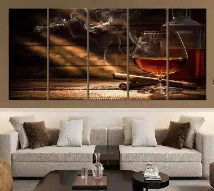 Whiskey and Cigar Wall Art Canvas Print showcases a glass of brandy, a lit cigar, and swirling smoke. This museum-quality canvas is ready to hang and features a UV-protective coating for enduring vibrancy.