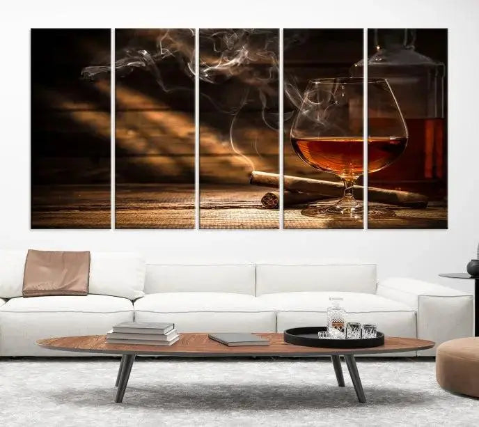 Whiskey and Cigar Wall Art Canvas Print showcases a glass of brandy, a lit cigar, and swirling smoke. This museum-quality canvas is ready to hang and features a UV-protective coating for enduring vibrancy.