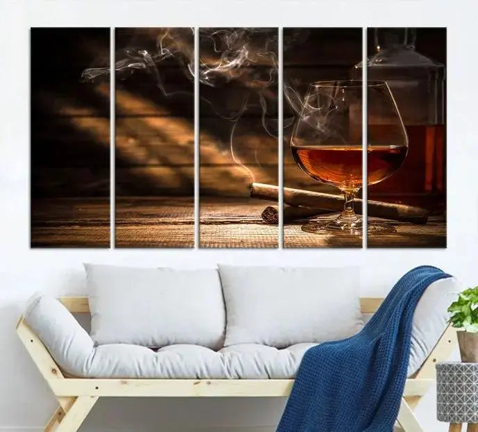 Whiskey and Cigar Wall Art Canvas Print showcases a glass of brandy, a lit cigar, and swirling smoke. This museum-quality canvas is ready to hang and features a UV-protective coating for enduring vibrancy.