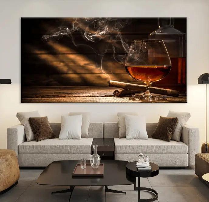 Whiskey and Cigar Wall Art Canvas Print showcases a glass of brandy, a lit cigar, and swirling smoke. This museum-quality canvas is ready to hang and features a UV-protective coating for enduring vibrancy.