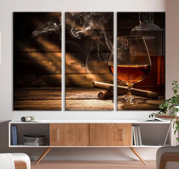 Whiskey and Cigar Wall Art Canvas Print showcases a glass of brandy, a lit cigar, and swirling smoke. This museum-quality canvas is ready to hang and features a UV-protective coating for enduring vibrancy.