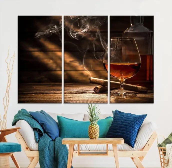 Whiskey and Cigar Wall Art Canvas Print showcases a glass of brandy, a lit cigar, and swirling smoke. This museum-quality canvas is ready to hang and features a UV-protective coating for enduring vibrancy.