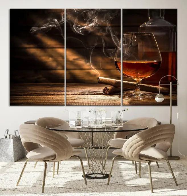 Whiskey and Cigar Wall Art Canvas Print showcases a glass of brandy, a lit cigar, and swirling smoke. This museum-quality canvas is ready to hang and features a UV-protective coating for enduring vibrancy.