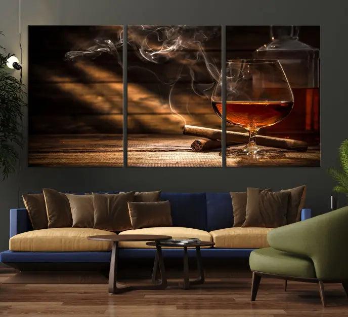 Whiskey and Cigar Wall Art Canvas Print showcases a glass of brandy, a lit cigar, and swirling smoke. This museum-quality canvas is ready to hang and features a UV-protective coating for enduring vibrancy.