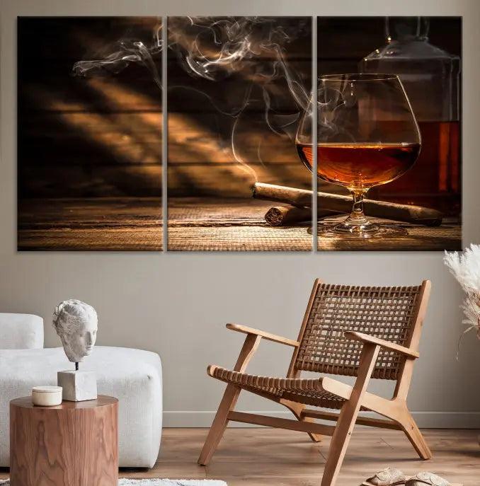 Whiskey and Cigar Wall Art Canvas Print showcases a glass of brandy, a lit cigar, and swirling smoke. This museum-quality canvas is ready to hang and features a UV-protective coating for enduring vibrancy.