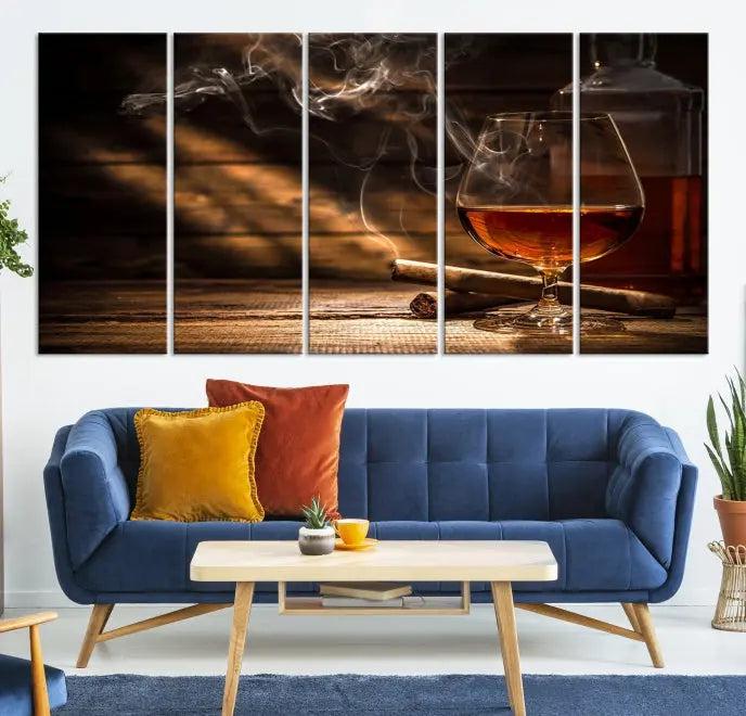 Whiskey and Cigar Wall Art Canvas Print showcases a glass of brandy, a lit cigar, and swirling smoke. This museum-quality canvas is ready to hang and features a UV-protective coating for enduring vibrancy.