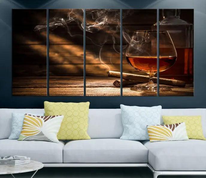 Whiskey and Cigar Wall Art Canvas Print showcases a glass of brandy, a lit cigar, and swirling smoke. This museum-quality canvas is ready to hang and features a UV-protective coating for enduring vibrancy.