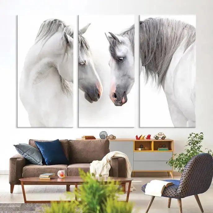 The "White Horse Wall Art Animal Canvas Print," featuring two white horses facing each other, is elegantly displayed. This triptych is gallery wrapped on museum-quality canvas, ensuring long-lasting beauty and sophistication.