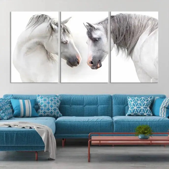 The "White Horse Wall Art Animal Canvas Print," featuring two white horses facing each other, is elegantly displayed. This triptych is gallery wrapped on museum-quality canvas, ensuring long-lasting beauty and sophistication.