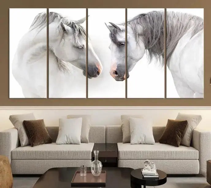 The "White Horse Wall Art Animal Canvas Print," featuring two white horses facing each other, is elegantly displayed. This triptych is gallery wrapped on museum-quality canvas, ensuring long-lasting beauty and sophistication.