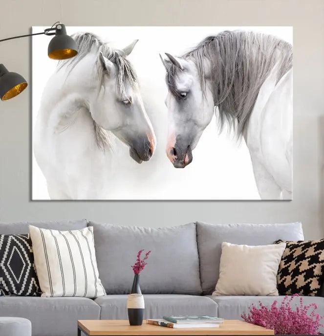 The "White Horse Wall Art Animal Canvas Print," featuring two white horses facing each other, is elegantly displayed. This triptych is gallery wrapped on museum-quality canvas, ensuring long-lasting beauty and sophistication.