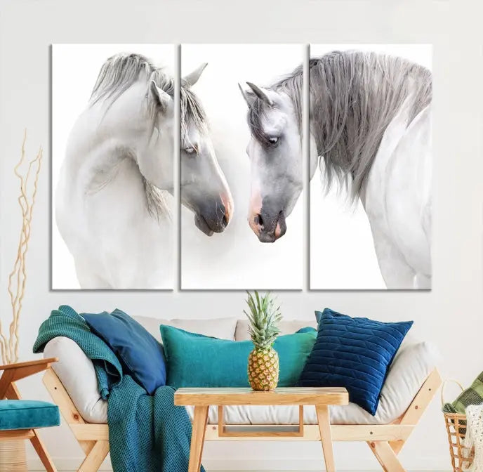 The "White Horse Wall Art Animal Canvas Print," featuring two white horses facing each other, is elegantly displayed. This triptych is gallery wrapped on museum-quality canvas, ensuring long-lasting beauty and sophistication.