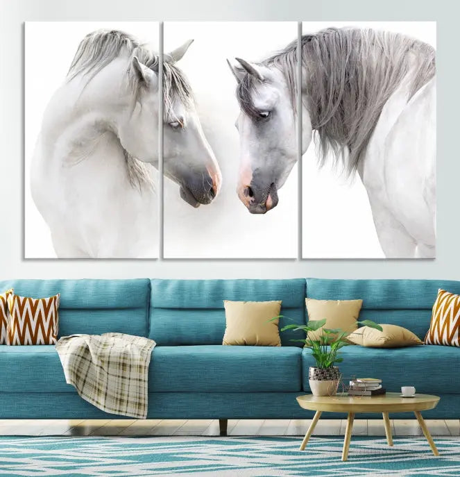 The "White Horse Wall Art Animal Canvas Print," featuring two white horses facing each other, is elegantly displayed. This triptych is gallery wrapped on museum-quality canvas, ensuring long-lasting beauty and sophistication.