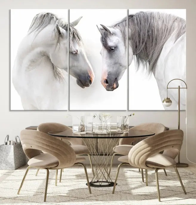 The "White Horse Wall Art Animal Canvas Print," featuring two white horses facing each other, is elegantly displayed. This triptych is gallery wrapped on museum-quality canvas, ensuring long-lasting beauty and sophistication.