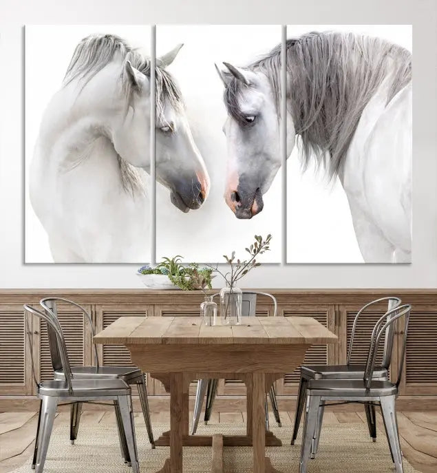 The "White Horse Wall Art Animal Canvas Print," featuring two white horses facing each other, is elegantly displayed. This triptych is gallery wrapped on museum-quality canvas, ensuring long-lasting beauty and sophistication.