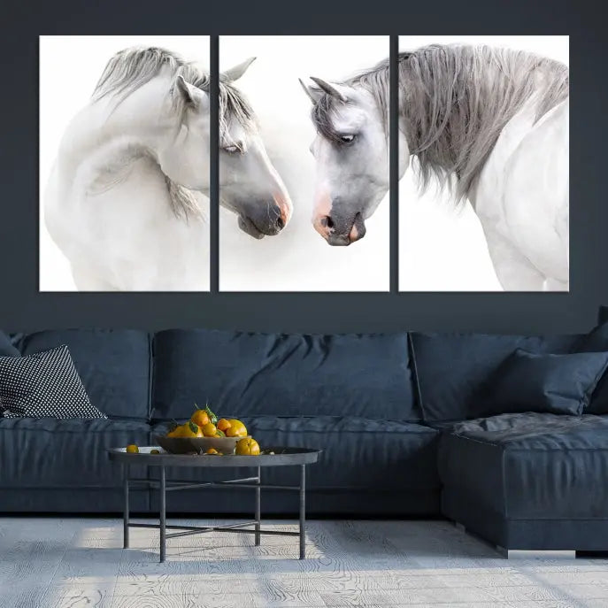 The "White Horse Wall Art Animal Canvas Print," featuring two white horses facing each other, is elegantly displayed. This triptych is gallery wrapped on museum-quality canvas, ensuring long-lasting beauty and sophistication.