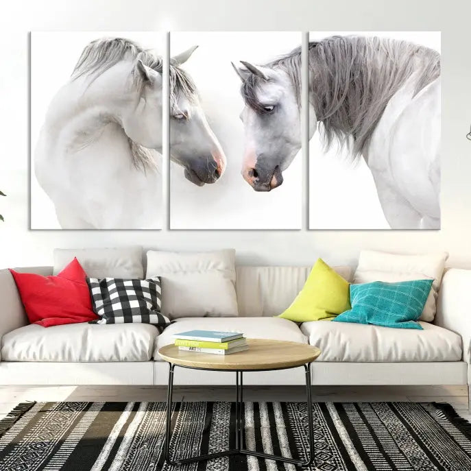 The "White Horse Wall Art Animal Canvas Print," featuring two white horses facing each other, is elegantly displayed. This triptych is gallery wrapped on museum-quality canvas, ensuring long-lasting beauty and sophistication.