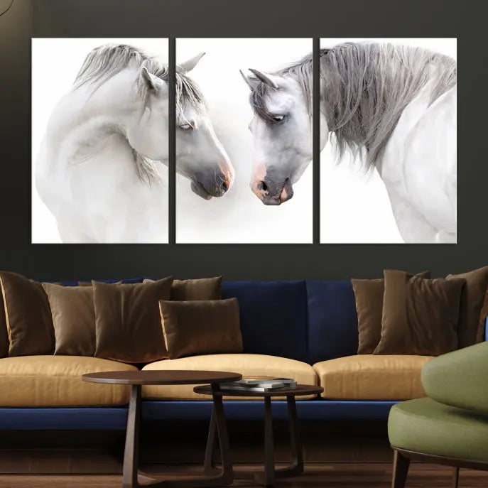 The "White Horse Wall Art Animal Canvas Print," featuring two white horses facing each other, is elegantly displayed. This triptych is gallery wrapped on museum-quality canvas, ensuring long-lasting beauty and sophistication.