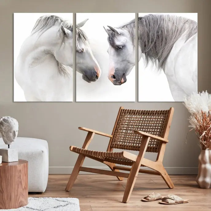 The "White Horse Wall Art Animal Canvas Print," featuring two white horses facing each other, is elegantly displayed. This triptych is gallery wrapped on museum-quality canvas, ensuring long-lasting beauty and sophistication.