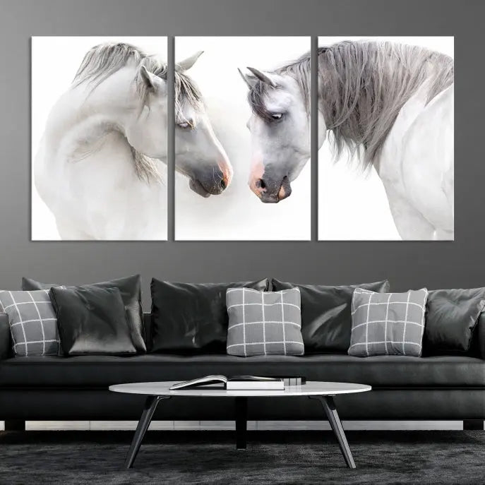 The "White Horse Wall Art Animal Canvas Print," featuring two white horses facing each other, is elegantly displayed. This triptych is gallery wrapped on museum-quality canvas, ensuring long-lasting beauty and sophistication.