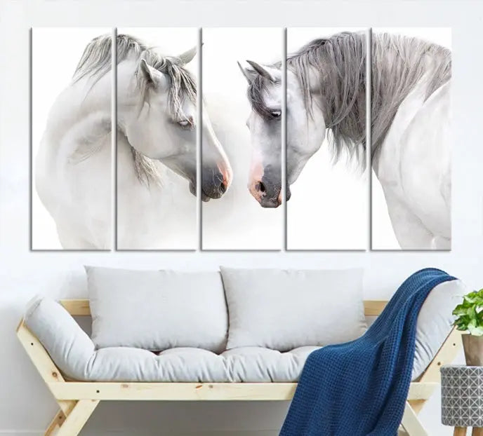 The "White Horse Wall Art Animal Canvas Print," featuring two white horses facing each other, is elegantly displayed. This triptych is gallery wrapped on museum-quality canvas, ensuring long-lasting beauty and sophistication.