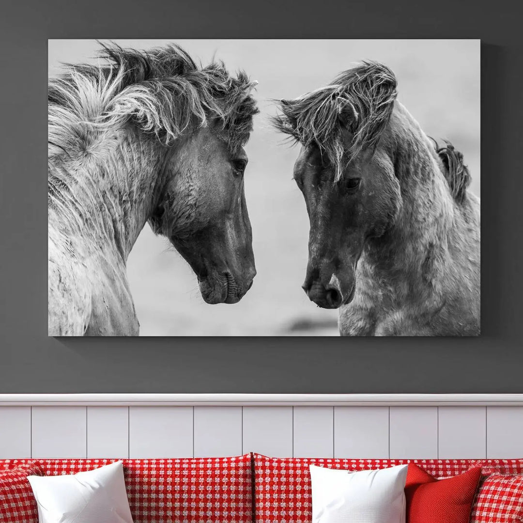 The "White Horses Wall Art Canvas Print" features a striking black and white triptych of two horses facing each other, perfect for display on a dark wall. Each piece is crafted on museum-quality poly-cotton canvas and meticulously hand-assembled, ensuring both elegance and long-lasting durability. Elevate your space effortlessly with free shipping included.