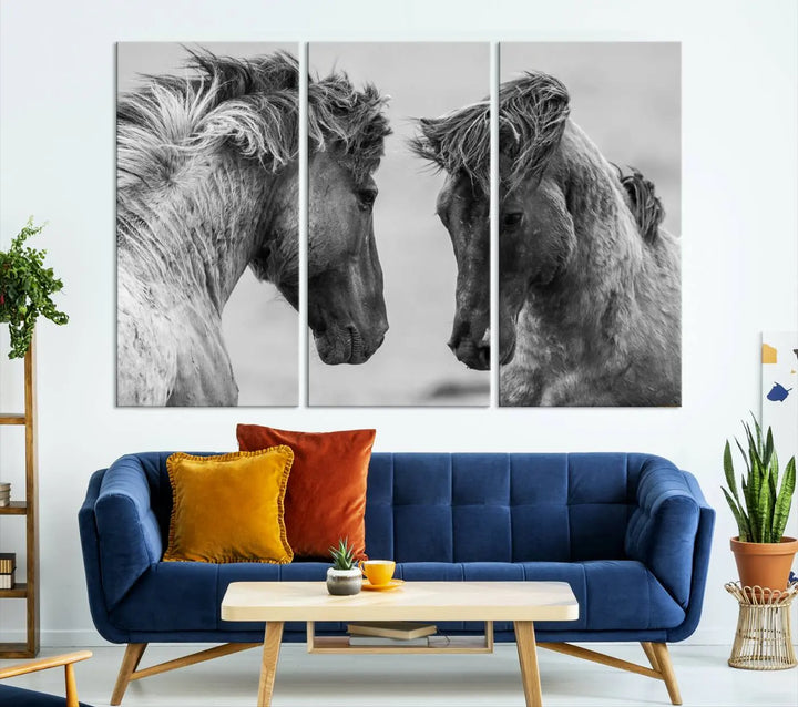 The "White Horses Wall Art Canvas Print" features a striking black and white triptych of two horses facing each other, perfect for display on a dark wall. Each piece is crafted on museum-quality poly-cotton canvas and meticulously hand-assembled, ensuring both elegance and long-lasting durability. Elevate your space effortlessly with free shipping included.