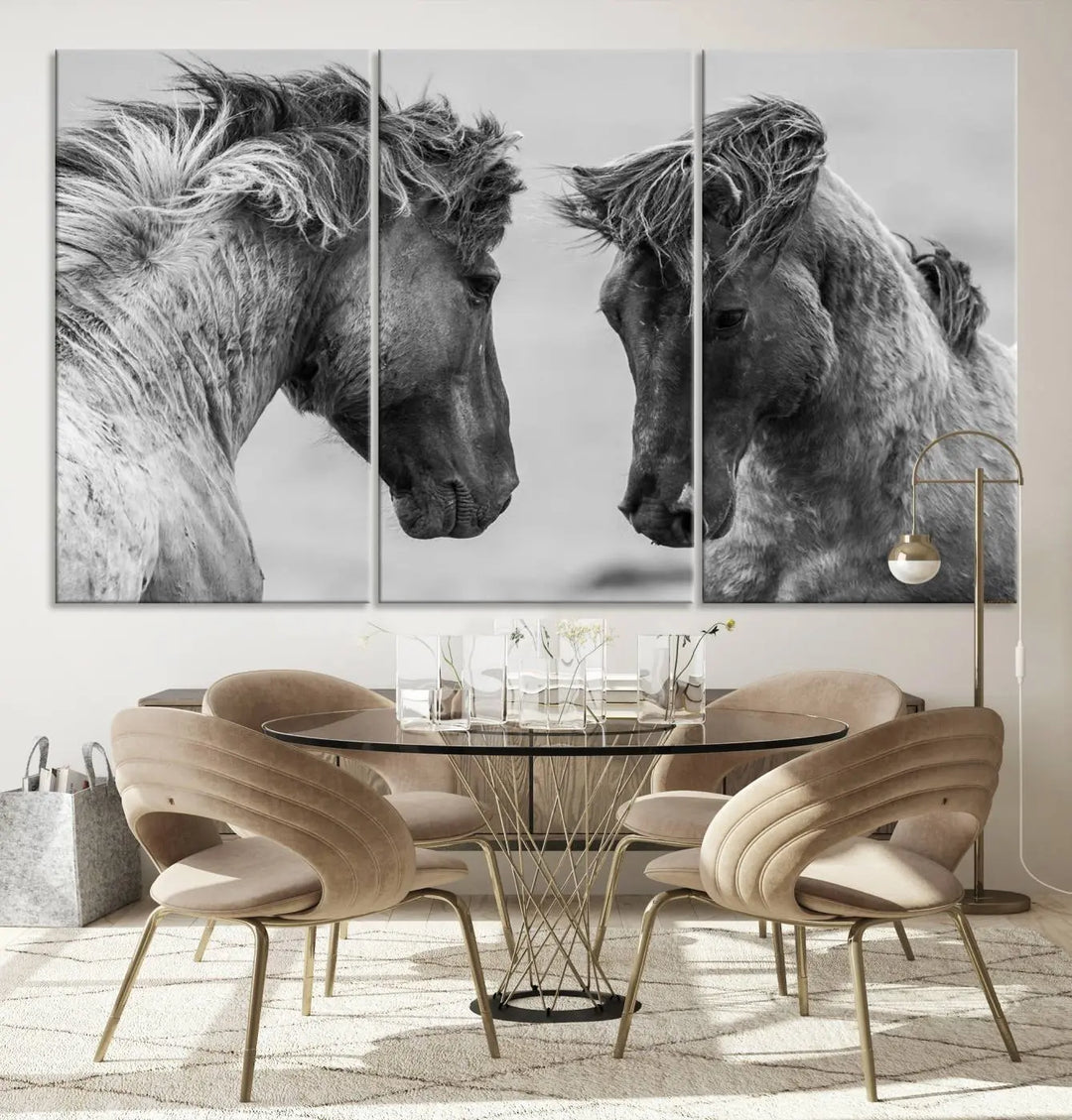 The "White Horses Wall Art Canvas Print" features a striking black and white triptych of two horses facing each other, perfect for display on a dark wall. Each piece is crafted on museum-quality poly-cotton canvas and meticulously hand-assembled, ensuring both elegance and long-lasting durability. Elevate your space effortlessly with free shipping included.