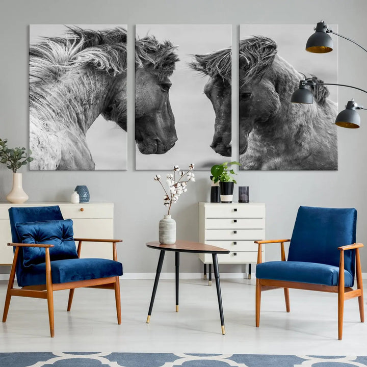 The "White Horses Wall Art Canvas Print" features a striking black and white triptych of two horses facing each other, perfect for display on a dark wall. Each piece is crafted on museum-quality poly-cotton canvas and meticulously hand-assembled, ensuring both elegance and long-lasting durability. Elevate your space effortlessly with free shipping included.