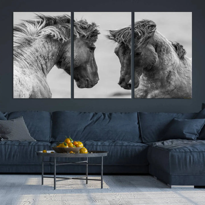 The "White Horses Wall Art Canvas Print" features a striking black and white triptych of two horses facing each other, perfect for display on a dark wall. Each piece is crafted on museum-quality poly-cotton canvas and meticulously hand-assembled, ensuring both elegance and long-lasting durability. Elevate your space effortlessly with free shipping included.