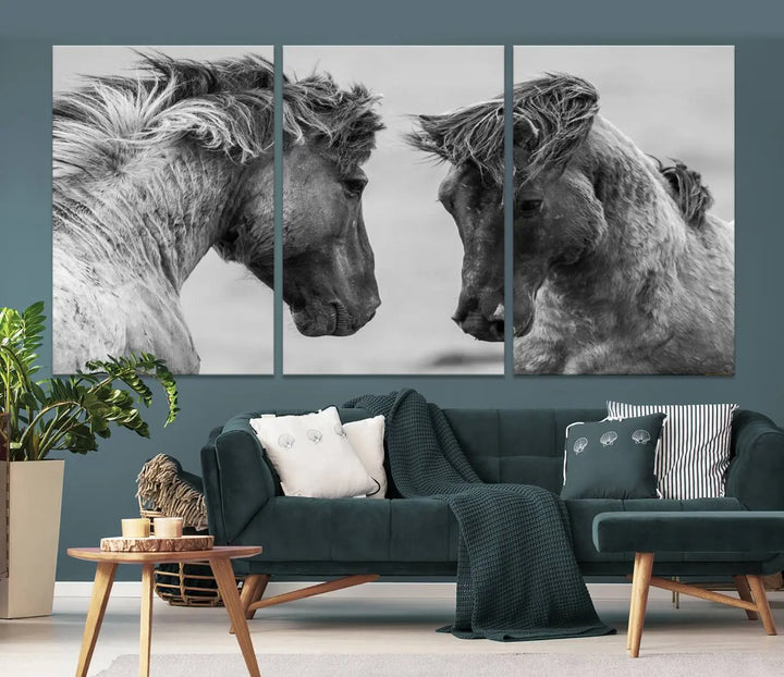 The "White Horses Wall Art Canvas Print" features a striking black and white triptych of two horses facing each other, perfect for display on a dark wall. Each piece is crafted on museum-quality poly-cotton canvas and meticulously hand-assembled, ensuring both elegance and long-lasting durability. Elevate your space effortlessly with free shipping included.