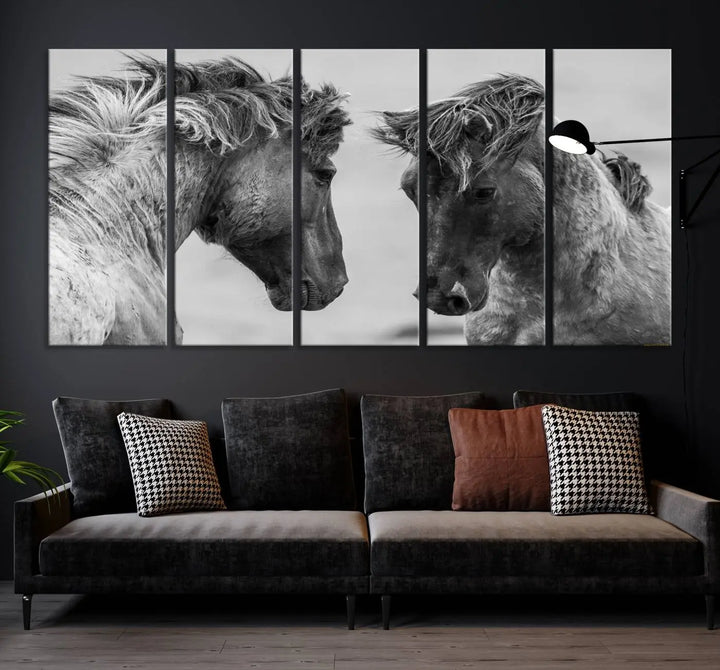 The "White Horses Wall Art Canvas Print" features a striking black and white triptych of two horses facing each other, perfect for display on a dark wall. Each piece is crafted on museum-quality poly-cotton canvas and meticulously hand-assembled, ensuring both elegance and long-lasting durability. Elevate your space effortlessly with free shipping included.