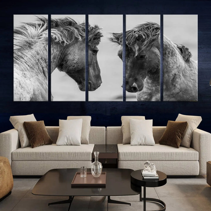 The "White Horses Wall Art Canvas Print" features a striking black and white triptych of two horses facing each other, perfect for display on a dark wall. Each piece is crafted on museum-quality poly-cotton canvas and meticulously hand-assembled, ensuring both elegance and long-lasting durability. Elevate your space effortlessly with free shipping included.