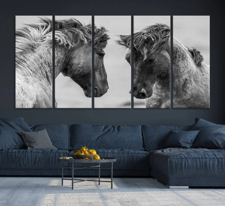 The "White Horses Wall Art Canvas Print" features a striking black and white triptych of two horses facing each other, perfect for display on a dark wall. Each piece is crafted on museum-quality poly-cotton canvas and meticulously hand-assembled, ensuring both elegance and long-lasting durability. Elevate your space effortlessly with free shipping included.