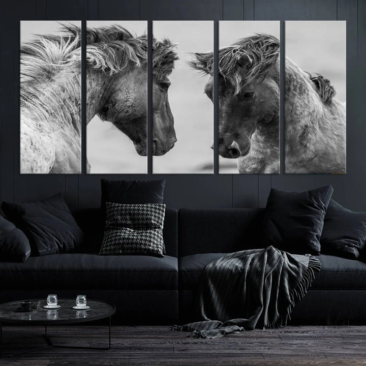 The "White Horses Wall Art Canvas Print" features a striking black and white triptych of two horses facing each other, perfect for display on a dark wall. Each piece is crafted on museum-quality poly-cotton canvas and meticulously hand-assembled, ensuring both elegance and long-lasting durability. Elevate your space effortlessly with free shipping included.