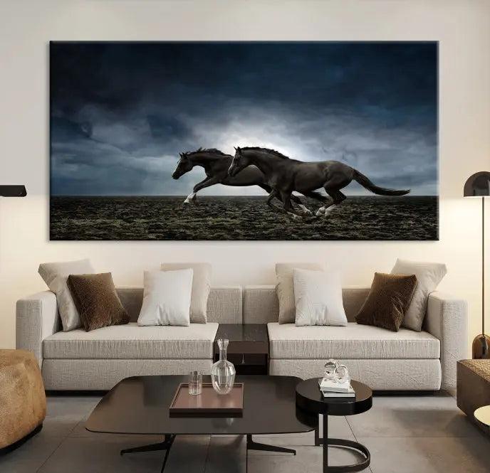 The Wild Horses Wall Art Canvas Print features a triptych of two galloping black horses set against a dark, cloudy landscape. This piece is gallery-wrapped on museum-quality canvas.