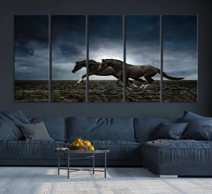 The Wild Horses Wall Art Canvas Print features a triptych of two galloping black horses set against a dark, cloudy landscape. This piece is gallery-wrapped on museum-quality canvas.