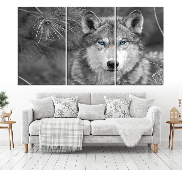 Displayed on the wall is the Wild Wolf Blue Eye Wall Art Canvas Print, a museum-quality triptych featuring a wolf with piercing blue eyes.