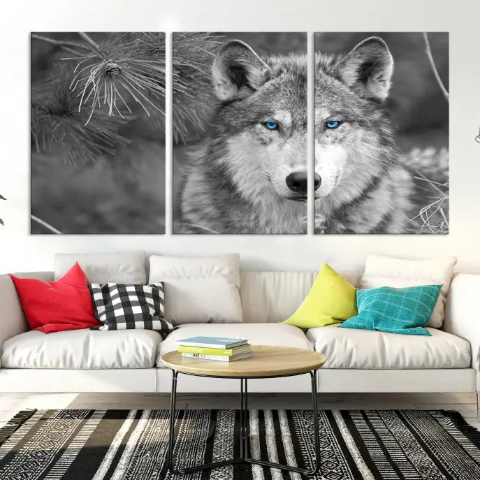 Displayed on the wall is the Wild Wolf Blue Eye Wall Art Canvas Print, a museum-quality triptych featuring a wolf with piercing blue eyes.