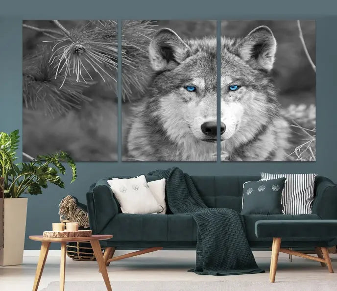 Displayed on the wall is the Wild Wolf Blue Eye Wall Art Canvas Print, a museum-quality triptych featuring a wolf with piercing blue eyes.