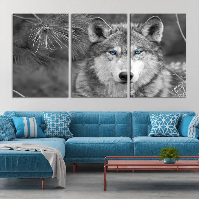 Displayed on the wall is the Wild Wolf Blue Eye Wall Art Canvas Print, a museum-quality triptych featuring a wolf with piercing blue eyes.