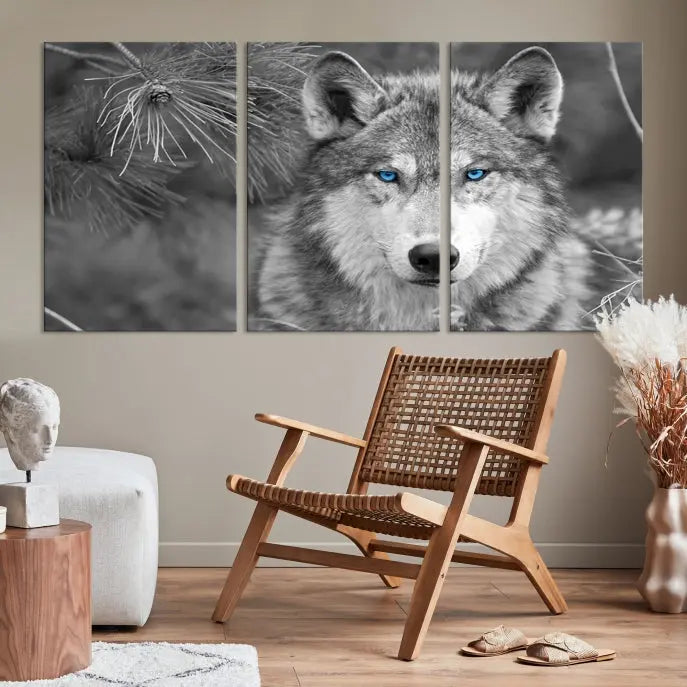 Displayed on the wall is the Wild Wolf Blue Eye Wall Art Canvas Print, a museum-quality triptych featuring a wolf with piercing blue eyes.